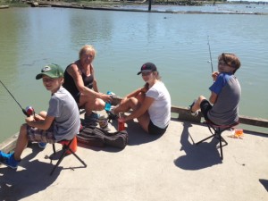 Janet fishing and crabbing with grandchildren