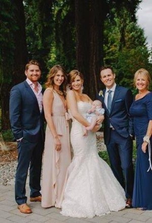 Lorriane's mom and husband Mark are reflected in the eyes of her children Tyler (right) Chelsea (left).Pictured with  spouses Hayley and Kevin and first grand baby Bowen