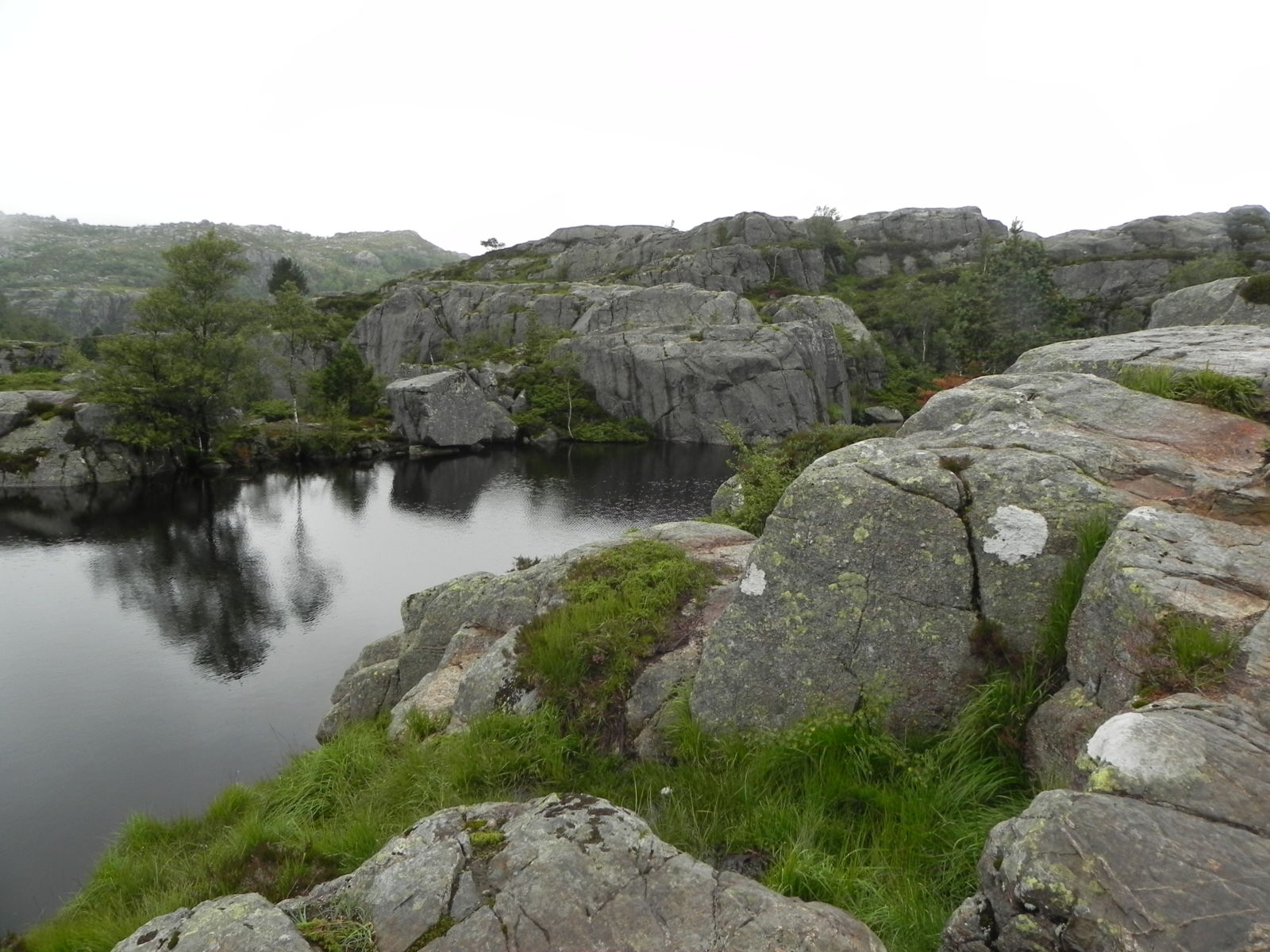 Climbing over boulders on Pulpit Rock hike